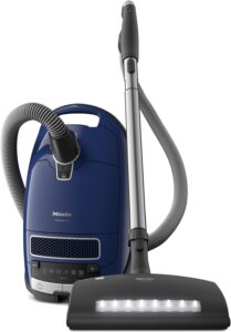 Blog Post Title is Mycotoxin Testing: 10 Warning Signs of Mold Toxicity. Image is of a Miele C3 Marin vacuum cleaner