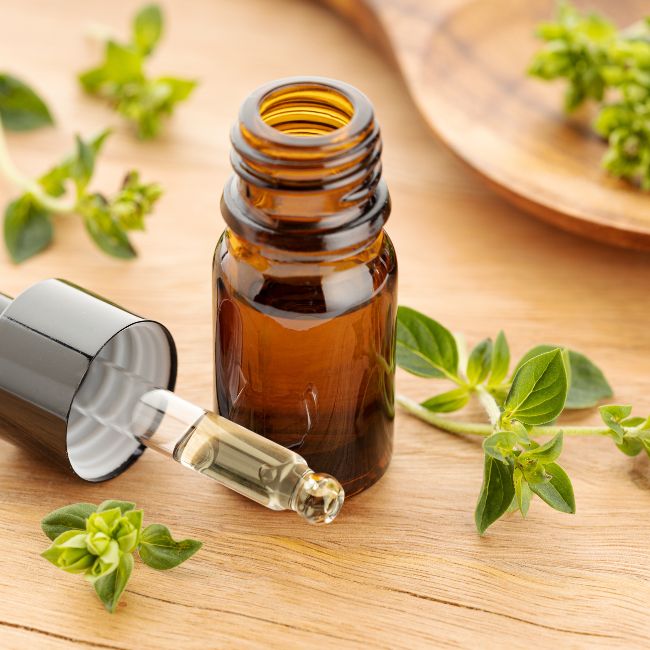 The blog title is Discover the Amazing Benefits of Organic Oregano Oil for Optimal Wellness. The image is of oregano leaves and a small dropper bottle